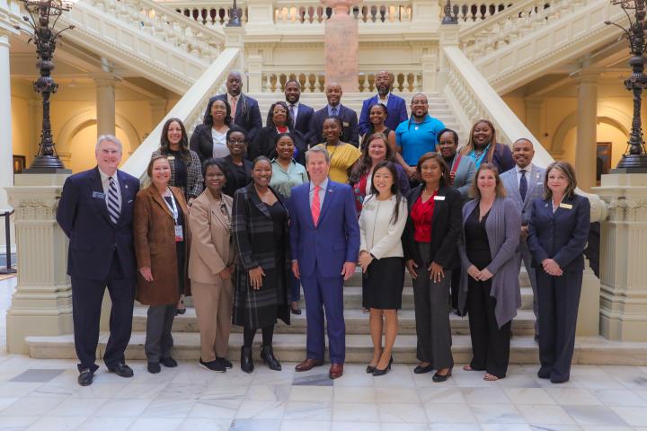 Gov. Brian P. Kemp (center front), Rep. Soo Hong (center front right) and Sen. Mike Hodges (front far left) pose with staff  from the Department of Administrative Services Small Business and Supplier Diversity Program, its partner organizations and businesses certified through the new Georgia Business Certification Program at the Georgia Capitol, on March 18, 2024.